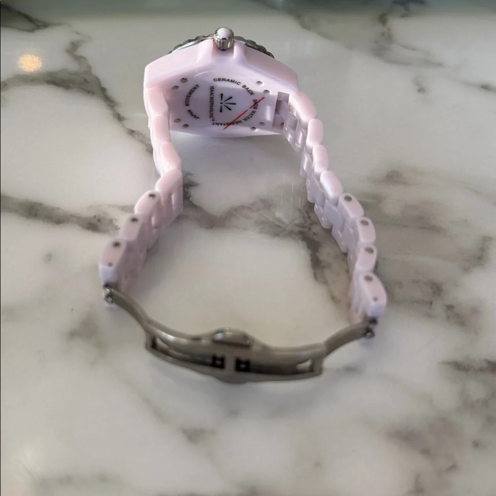 Isaac Mizrahi Live women’s pink sport watch with bracelet style band